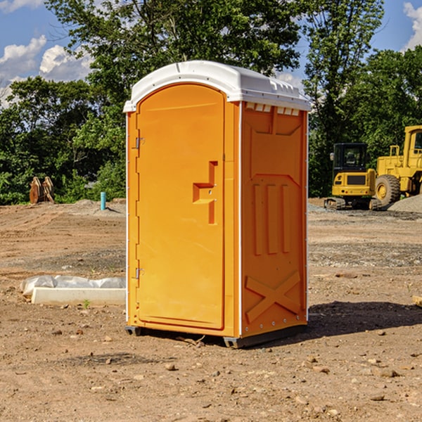 what is the cost difference between standard and deluxe portable restroom rentals in Rich